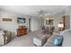 Cozy living room with a dining table and a mounted television for relaxed living and entertainment at 4900 Brittany S Dr # 808, St Petersburg, FL 33715