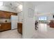 Open living area with tile floors leads to a balcony with water views at 4900 Brittany S Dr # 808, St Petersburg, FL 33715