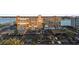 Aerial view of complex featuring mature landscaping, covered parking and views of the bay at 500 Treasure Island Cswy # 704, Treasure Island, FL 33706