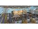 Aerial view of complex featuring mature landscaping, covered parking and views of the bay and city skyline at 500 Treasure Island Cswy # 704, Treasure Island, FL 33706