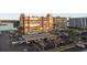 Aerial view of complex featuring mature landscaping, covered parking and views of water and city skyline at 500 Treasure Island Cswy # 704, Treasure Island, FL 33706