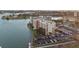 Aerial view of complex featuring mature landscaping and views of the bay at 500 Treasure Island Cswy # 704, Treasure Island, FL 33706