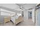 Inviting bedroom with wood-look flooring, ceiling fan and ensuite bathroom at 500 Treasure Island Cswy # 704, Treasure Island, FL 33706