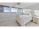 Bright bedroom with ample natural light and wood-look flooring at 500 Treasure Island Cswy # 704, Treasure Island, FL 33706