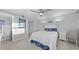 Bright and airy bedroom with wood-look flooring and a comfy king-sized bed at 500 Treasure Island Cswy # 704, Treasure Island, FL 33706