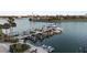 Aerial view of complex featuring yacht and boat docks and jet ski lifts at 500 Treasure Island Cswy # 704, Treasure Island, FL 33706