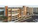 A beautiful condo building featuring covered parking and waterfront views at 500 Treasure Island Cswy # 704, Treasure Island, FL 33706