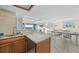 Open floor plan showcases kitchen with breakfast bar, granite counters, dining and living areas at 500 Treasure Island Cswy # 704, Treasure Island, FL 33706