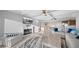 A bright living room features a fireplace, television, and great sunlight at 500 Treasure Island Cswy # 704, Treasure Island, FL 33706