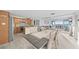 Spacious open floor plan with kitchen, dining area, living room, and water views at 500 Treasure Island Cswy # 704, Treasure Island, FL 33706