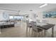 A combined living and dining room with a beautiful water view in the background at 500 Treasure Island Cswy # 704, Treasure Island, FL 33706