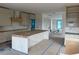 Open-concept kitchen featuring a large island, custom cabinets, and modern appliances at 501 W Ross Ave # 1, Tampa, FL 33602