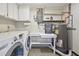Well-equipped laundry room with modern appliances, shelving, and efficient storage at 5055 29Th S St, St Petersburg, FL 33712