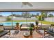 The screened-in patio overlooks a pool and backyard, perfect for relaxation at 5055 29Th S St, St Petersburg, FL 33712