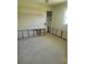 Bedroom in renovation with exposed studs and terrazzo floors at 5105 Bonito Dr, New Port Richey, FL 34652