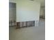 Renovation of the living room with exposed studs and terrazzo floors at 5105 Bonito Dr, New Port Richey, FL 34652