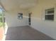 The covered patio has access to the home at 5105 Bonito Dr, New Port Richey, FL 34652