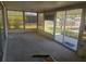 Enclosed sun room with large windows offering great views of the outdoor waterfront at 5105 Bonito Dr, New Port Richey, FL 34652