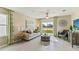 Bright living room with a comfortable sofa, contemporary decor, and scenic pond views at 5236 Salt Marsh Rd, Wimauma, FL 33598