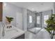 Bright bathroom featuring a walk-in shower with glass doors, and a modern sink and countertop at 5910 Caldera Ridge Dr, Lithia, FL 33547