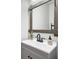 Bathroom featuring a modern sink with a gray vanity, white quartz countertops, and a rustic mirror frame at 5910 Caldera Ridge Dr, Lithia, FL 33547