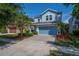 Charming two-story home with a well-manicured lawn and a two-car garage at 5910 Caldera Ridge Dr, Lithia, FL 33547