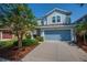 Charming two-story home with a well-maintained lawn, mature trees, and a two-car garage at 5910 Caldera Ridge Dr, Lithia, FL 33547