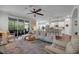 Bright and airy living area with an open floor plan, hardwood floors, and comfortable seating at 5910 Caldera Ridge Dr, Lithia, FL 33547