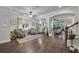 Spacious living room with hardwood floors, comfortable seating, and an open layout for modern living at 5910 Caldera Ridge Dr, Lithia, FL 33547