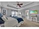 Spacious bedroom with a window view and en suite bathroom with sleek countertops and a glass door shower at 5910 Caldera Ridge Dr, Lithia, FL 33547