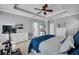 Spacious main bedroom featuring tray ceilings, ceiling fan, and and closets at 5910 Caldera Ridge Dr, Lithia, FL 33547