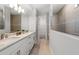 Modern bathroom featuring double vanities, elegant fixtures, and a large shower area for a spa-like experience at 5953 Bluestar Ct, Lakewood Ranch, FL 34211