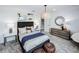 Cozy bedroom features a comfortable bed, neutral tones, and stylish decor at 5953 Bluestar Ct, Lakewood Ranch, FL 34211