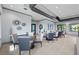 Modern clubhouse with tables, chairs, and decorative wall art for a stylish and inviting space at 5953 Bluestar Ct, Lakewood Ranch, FL 34211