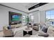Comfortable clubhouse seating area with a large TV and stylish decor creating a relaxing atmosphere at 5953 Bluestar Ct, Lakewood Ranch, FL 34211