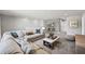 Bright living room features plush sofa, decorative pillows, and stylish furnishings at 5953 Bluestar Ct, Lakewood Ranch, FL 34211