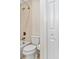 Bathroom featuring a toilet, bathtub and shower with a white closet door at 6407 E 112Th Ave, Temple Terrace, FL 33617