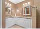 Bathroom featuring double sinks and white cabinetry at 6407 E 112Th Ave, Temple Terrace, FL 33617