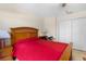 Cozy bedroom featuring a wooden bed frame, bedside tables, and a closet, perfect for comfortable living at 6407 E 112Th Ave, Temple Terrace, FL 33617