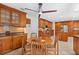 Bright breakfast nook with custom cabinets, recessed lighting, and casual dining space at 6407 E 112Th Ave, Temple Terrace, FL 33617
