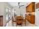 Cozy breakfast nook featuring an elegant ceiling fan and French door access to the pool at 6407 E 112Th Ave, Temple Terrace, FL 33617
