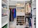 Walk-in closet with custom shelving, shoe racks, and ample storage space at 6407 E 112Th Ave, Temple Terrace, FL 33617