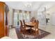 Dining room featuring a wooden table, chairs, and large window at 6407 E 112Th Ave, Temple Terrace, FL 33617