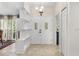 Bright foyer with double front door, tile flooring, and modern chandelier at 6407 E 112Th Ave, Temple Terrace, FL 33617