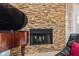 A luxurious grand piano next to a stone fireplace in a stunning living room at 6407 E 112Th Ave, Temple Terrace, FL 33617