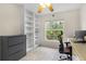 Office featuring built-in shelving and a large window providing natural light at 6407 E 112Th Ave, Temple Terrace, FL 33617
