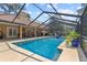 Enclosed screened-in pool with a large deck and ample space for outdoor entertaining at 6407 E 112Th Ave, Temple Terrace, FL 33617