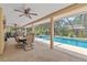 Relaxing screened-in pool area perfect for outdoor entertaining with outdoor dining at 6407 E 112Th Ave, Temple Terrace, FL 33617