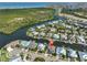 Breathtaking aerial view of the beautiful waterfront community showcasing a home with canal access and stunning water views at 715 Pinckney Dr, Apollo Beach, FL 33572