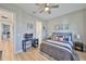 Cozy bedroom featuring a gray bed frame, work space and natural light at 715 Pinckney Dr, Apollo Beach, FL 33572
